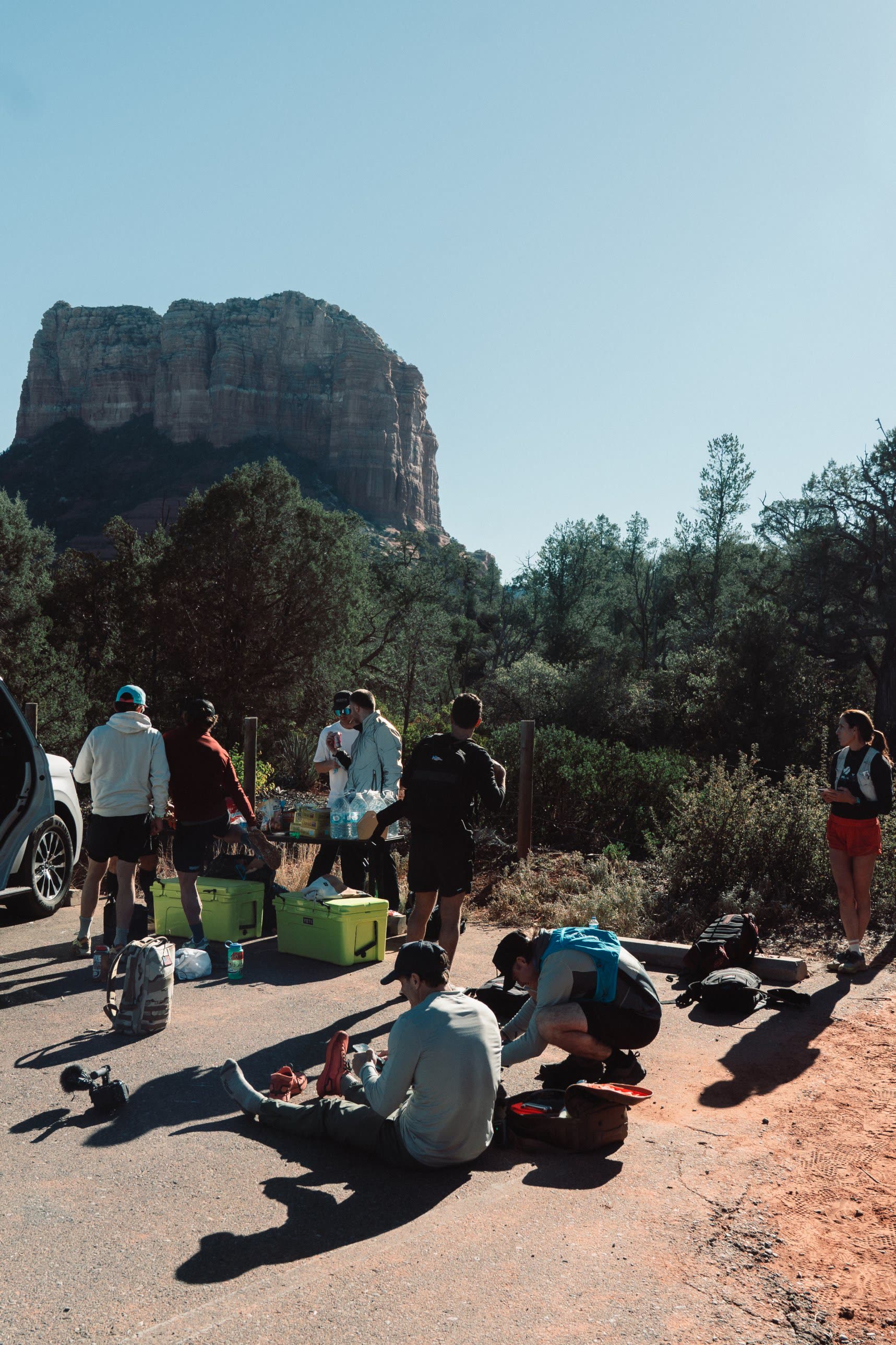 The crew refueling at a trailhead aid station below Courthouse Butte