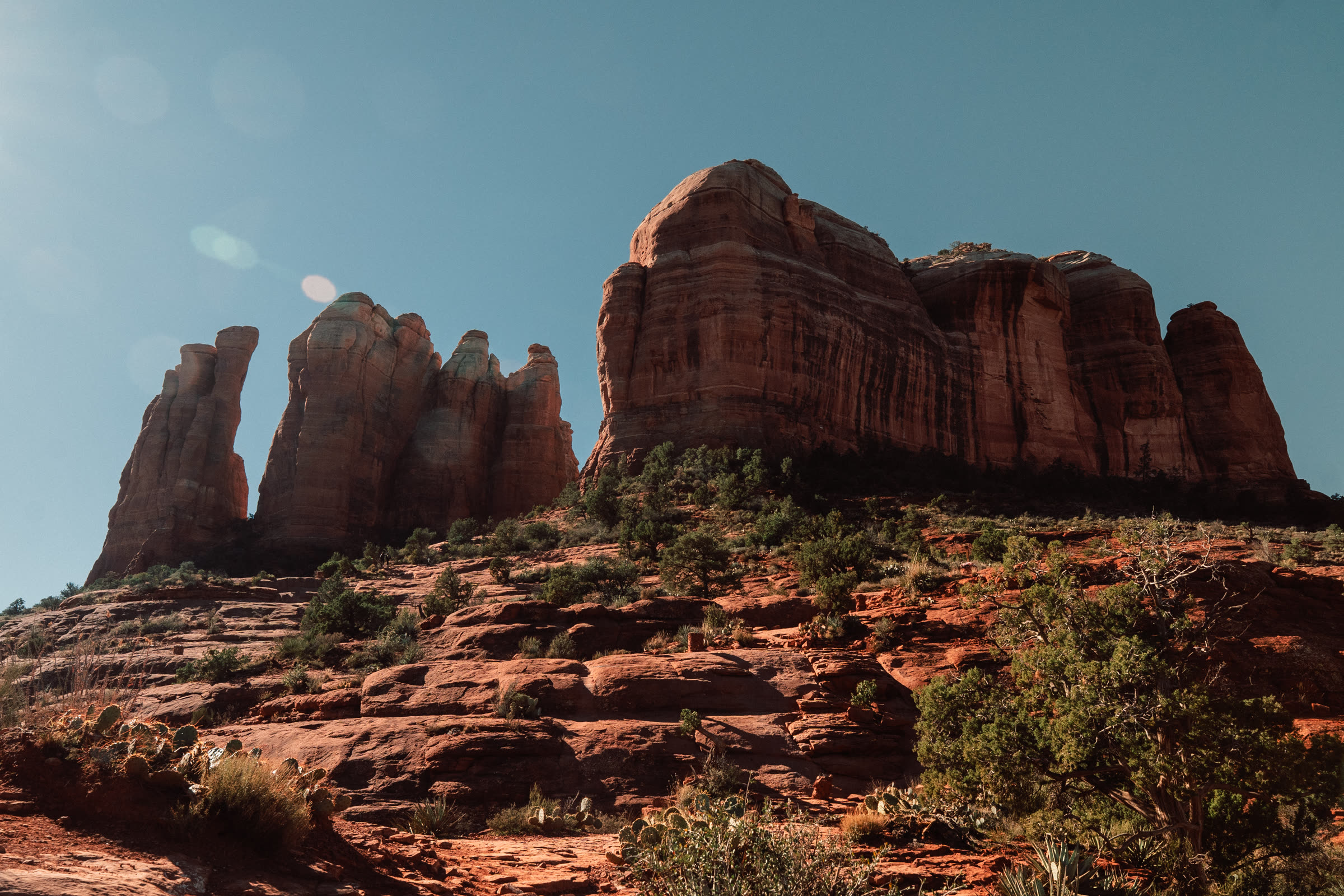 The spires of Cathedral Rock against a blue sky